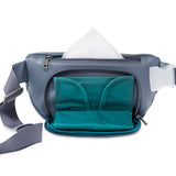 Fanny pack with a fold-out diaper bag compartment that can be swapped out with other accessories